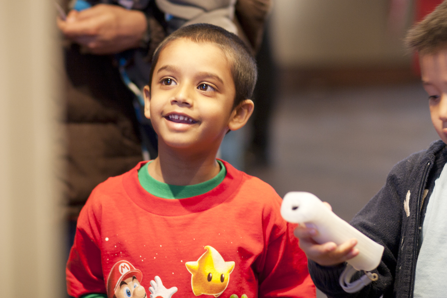 A young fan enthusiastically plays Mario Party TM 9 during the launch event this weekend at the Hard Rock Cafe in Toronto. The latest title released in the popular video game series is expected to be a new favourite of Nintendo fans.